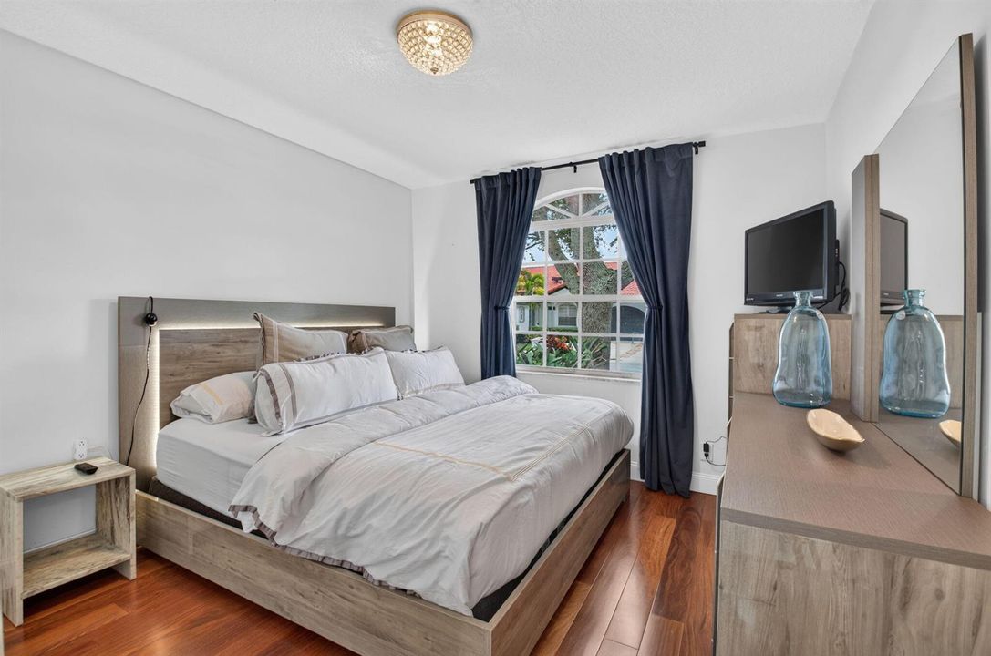 BRIGHT SECOND BEDROOM WITH WOOD FLOORS