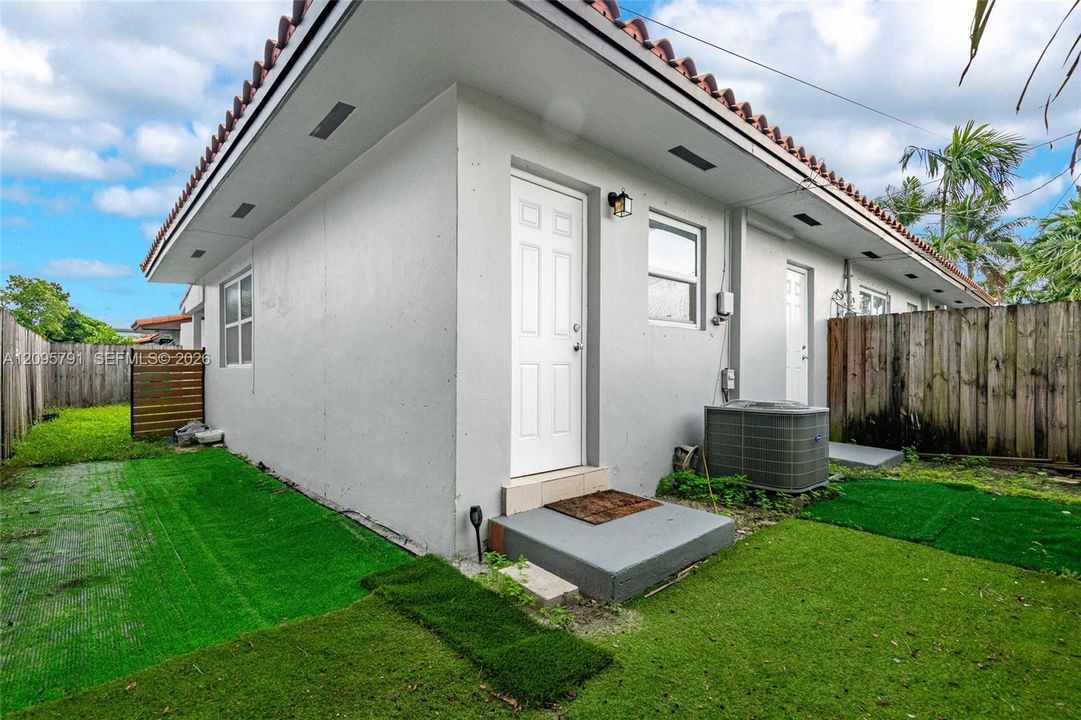 The area outside the kitchen door provides a private space to sit and enjoy the weather.