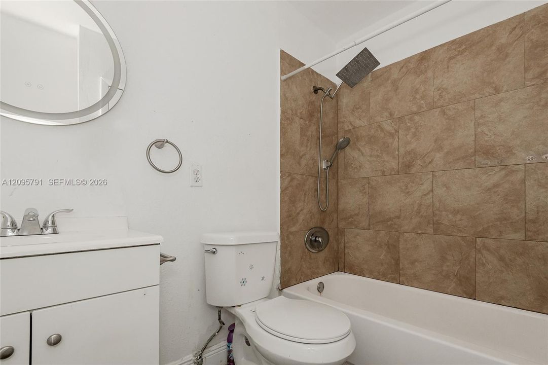 The tub and shower setup.