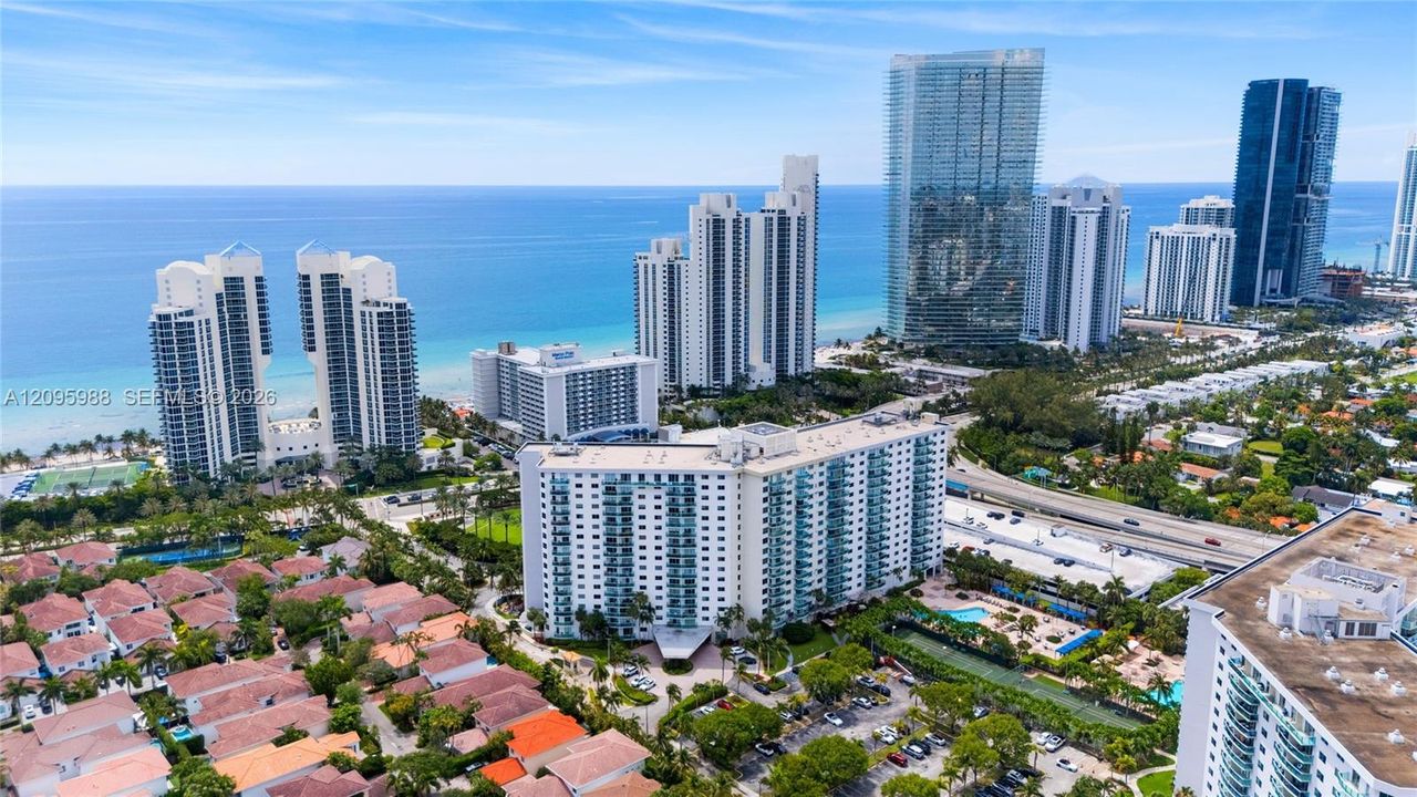 Ocean Reserve in its oceanfront neighborhood setting (aerial)