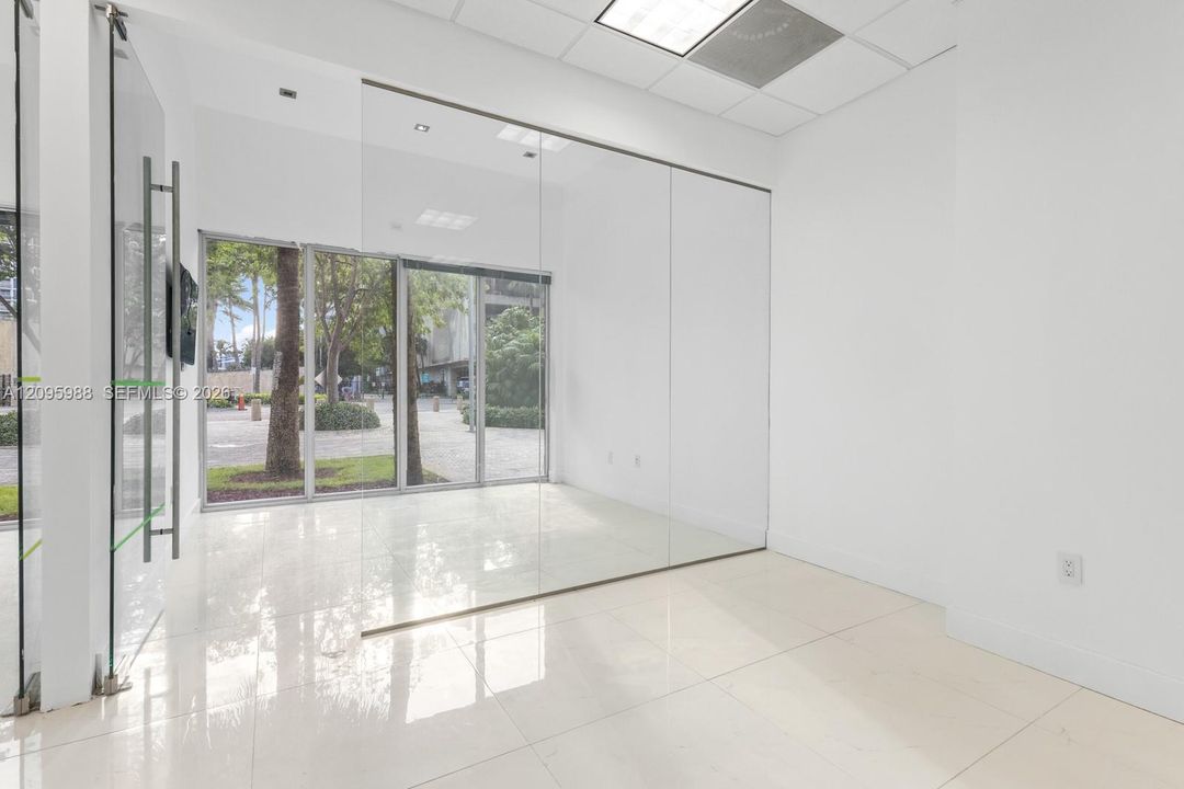 Glass-walled front room with storefront windows