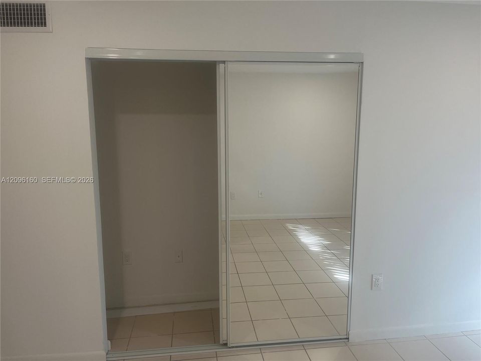 2nd bedroom mirrored closet