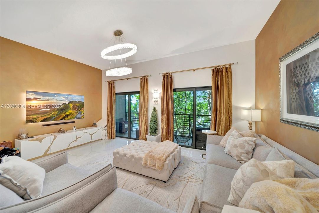2nd Floor living room area with balcony and gorgeous water view.