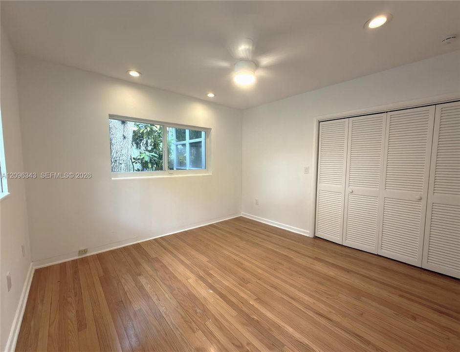 Private Back bedroom overlooking gated yard with double closet