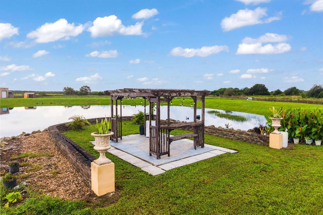 Beautiful gazebo next to the private pon