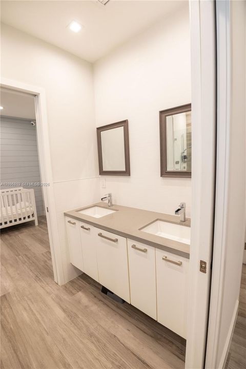 Jack and Jill Bathroom featuring a double vanity