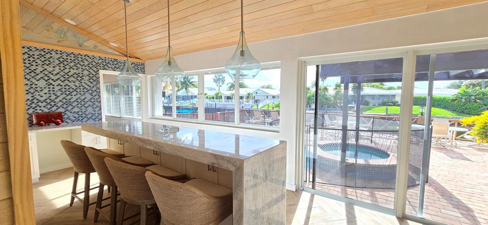 Waterfall bar overlooking pool & water