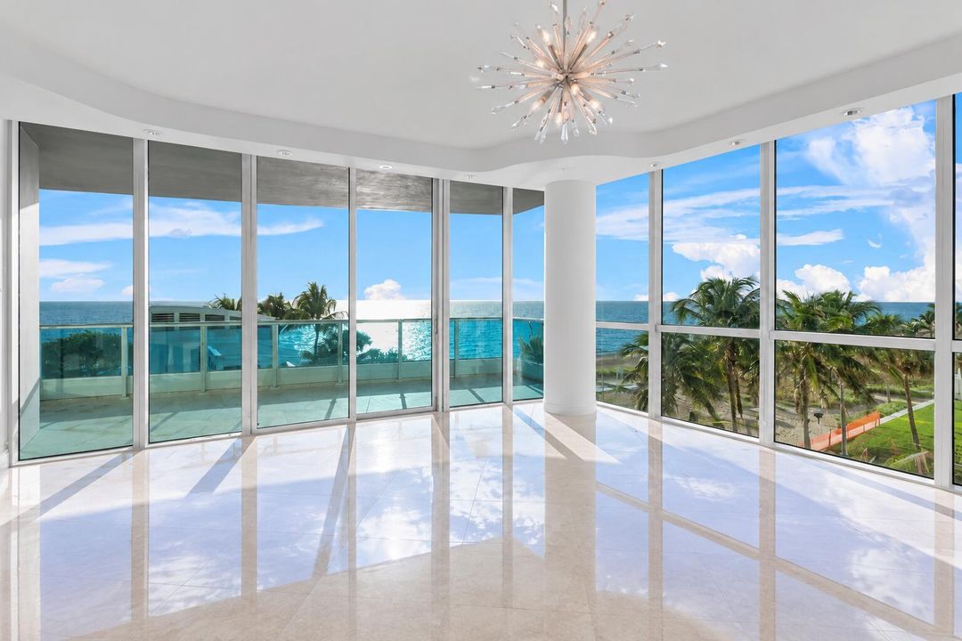 Sunlit Coastal Living Room with Ocean Vi