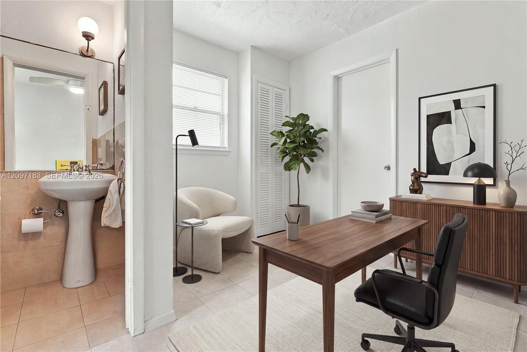Currently used as an office, this space has its own bathroom and can be used as a 4th bedroom (virtually staged)