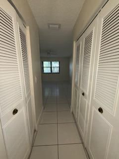 Primary bedroom hallway with closets