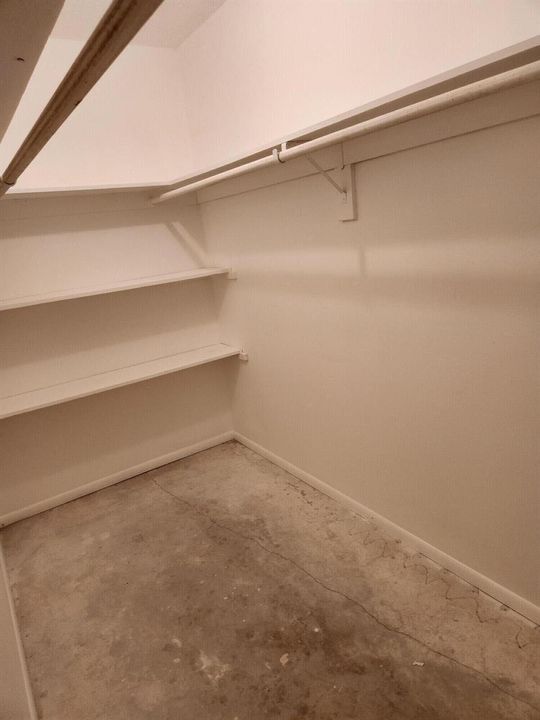 Large walk in closet in bedroom