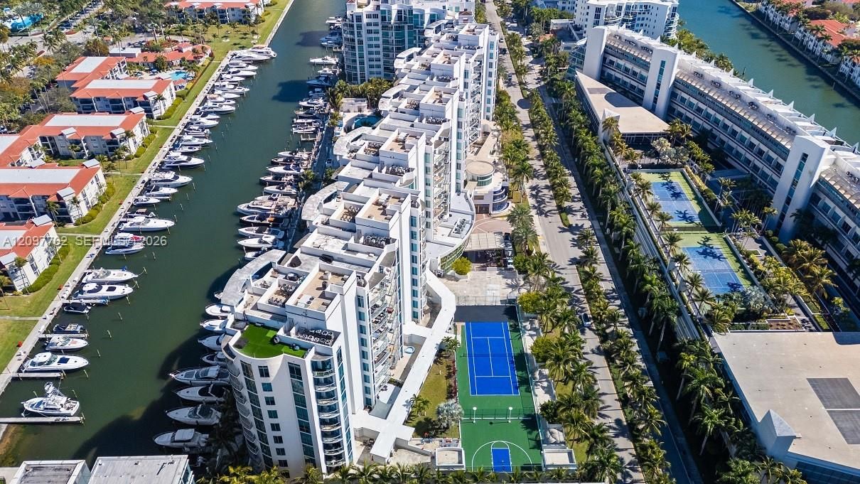 Enjoy 5-star amenities including tennis court and basketball court and waterfront pool deck