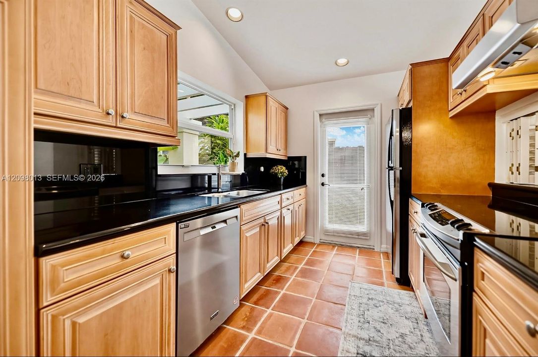 Kitchen featuring wood cabinetry,