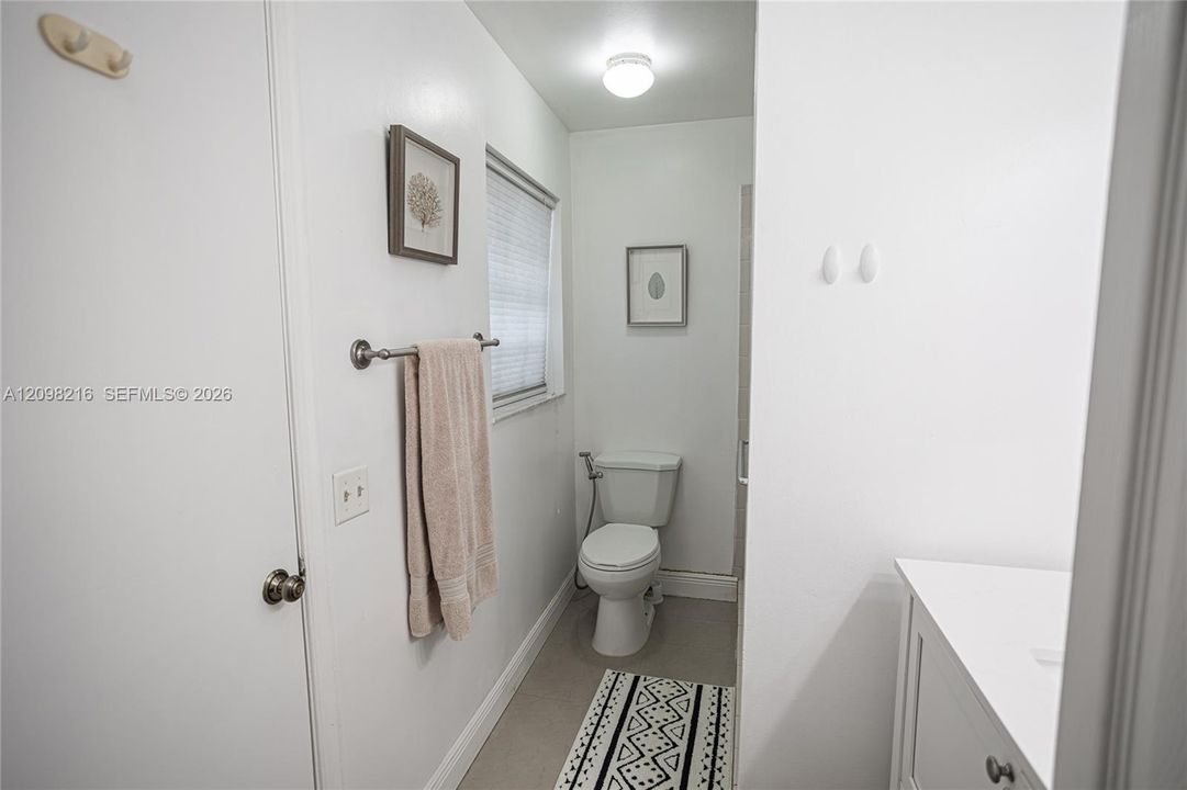 Clean, neutral bathroom with natural light.