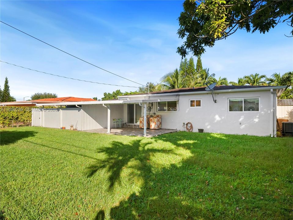 Expansive fenced private backyard offering generous outdoor space.