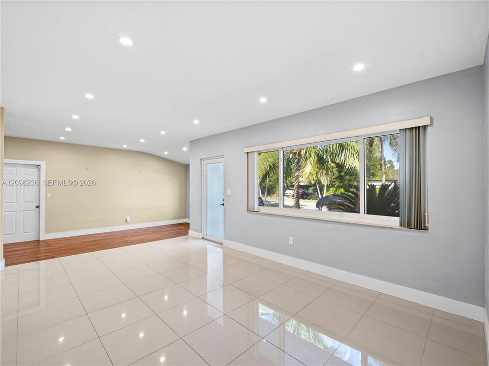 Light-filled interior featuring recessed lighting, large windows, and an open layout.