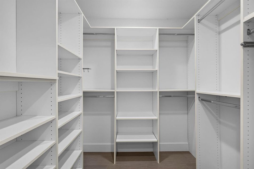 Very large walk-in closet in master