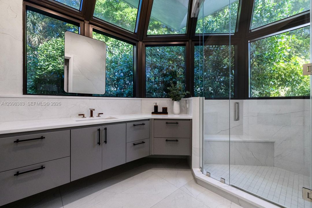 Spa-inspired primary bathroom with Steamist shower system at 2965 Surrey Lane, Weston Florida.