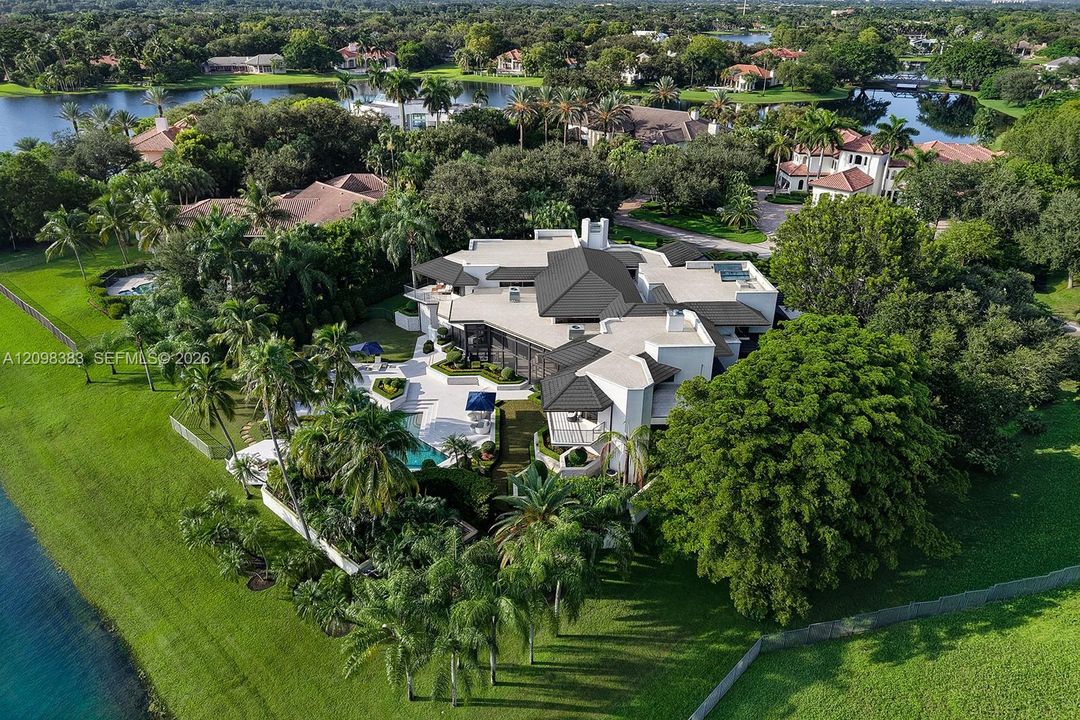 luxury home surrounded by mature landscaping
