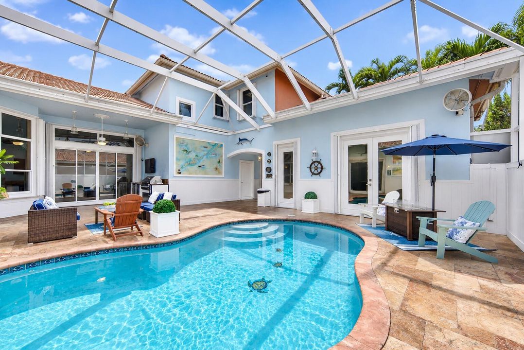 Sunny Coastal Screened Pool Courtyard