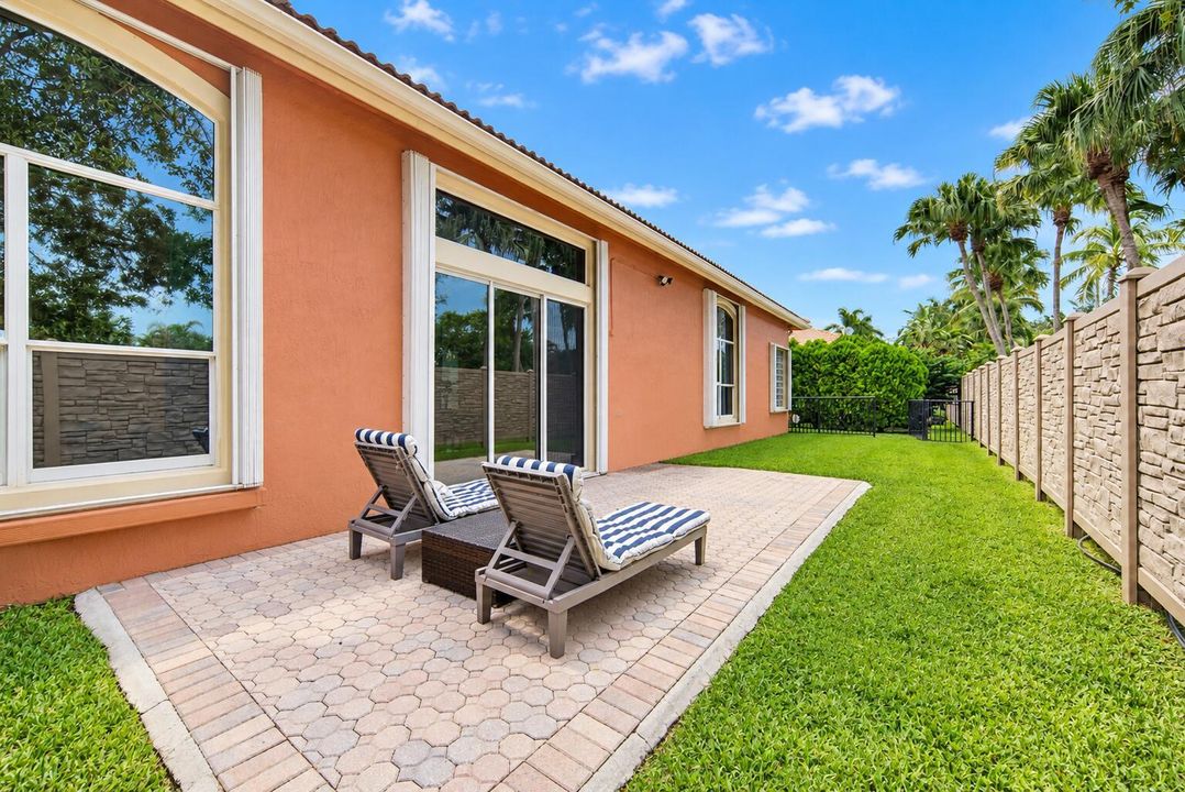 Sunny Terracotta Patio with Striped Chai