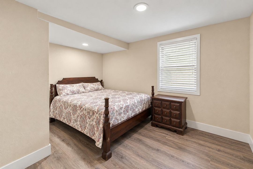 Tidy Traditional Bedroom with Floral Bed