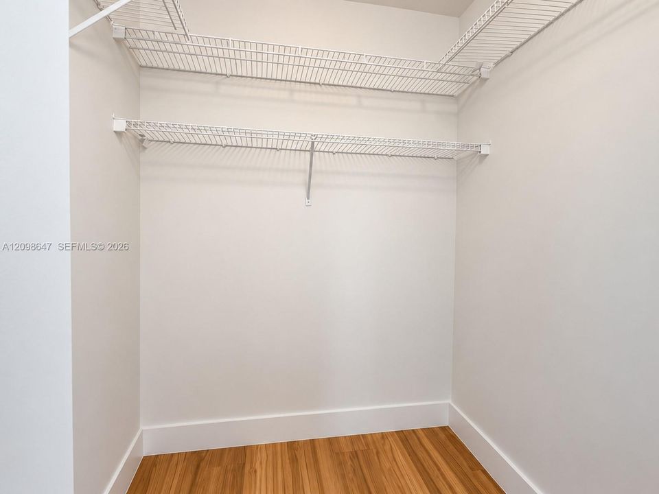 Built-in closet space featuring newly installed custom organization and built-in shelving.