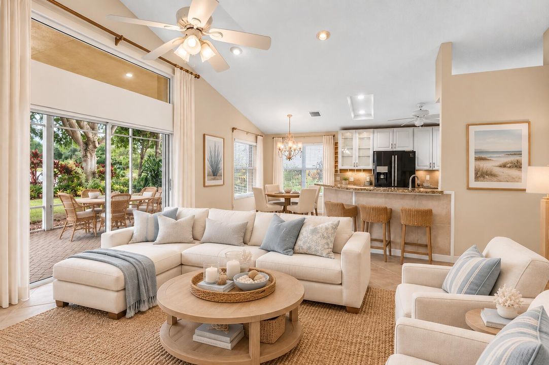 Staged TV room with view of lake