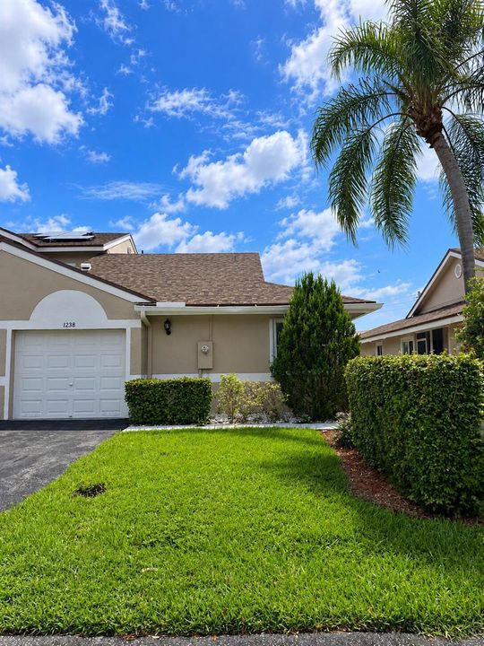 Sunny Suburban Home with Palm Trees