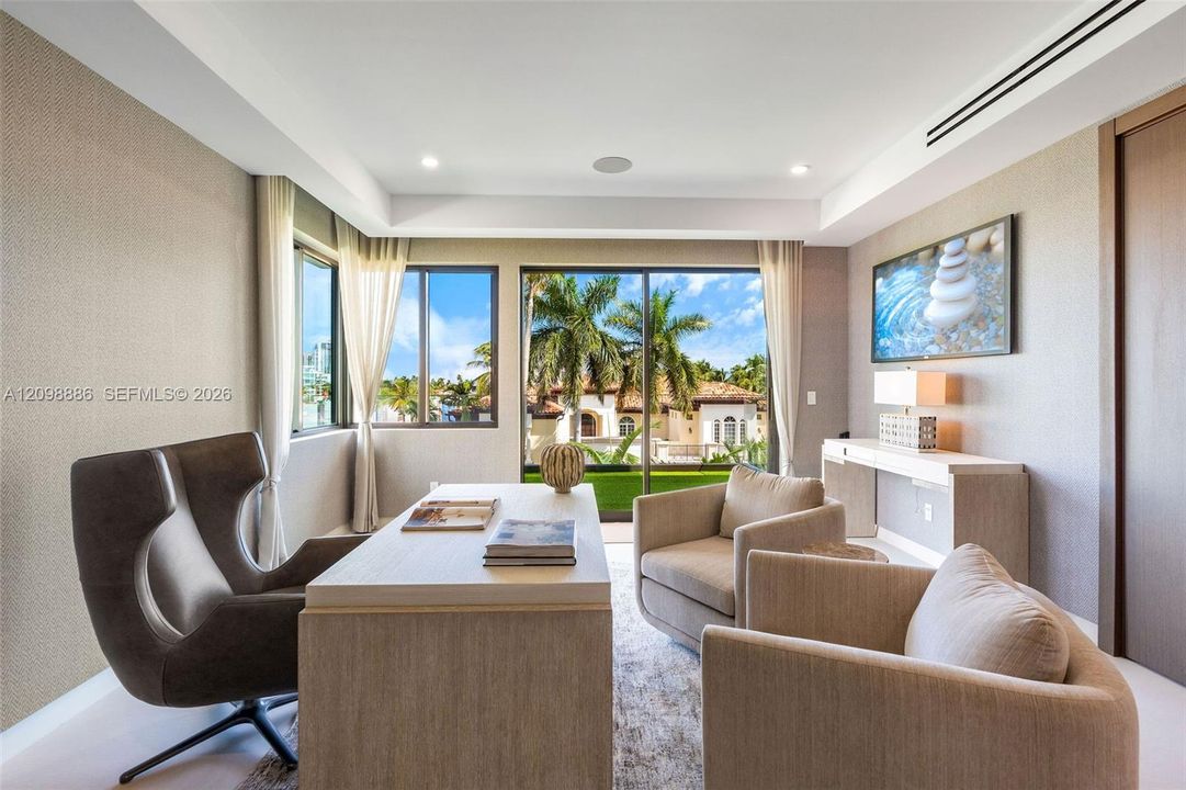 Room featuring textured wallpaper, recessed lighting, crown molding, built-in recessed wall shelving, and floor-to-ceiling glass doors with outdoor scenery