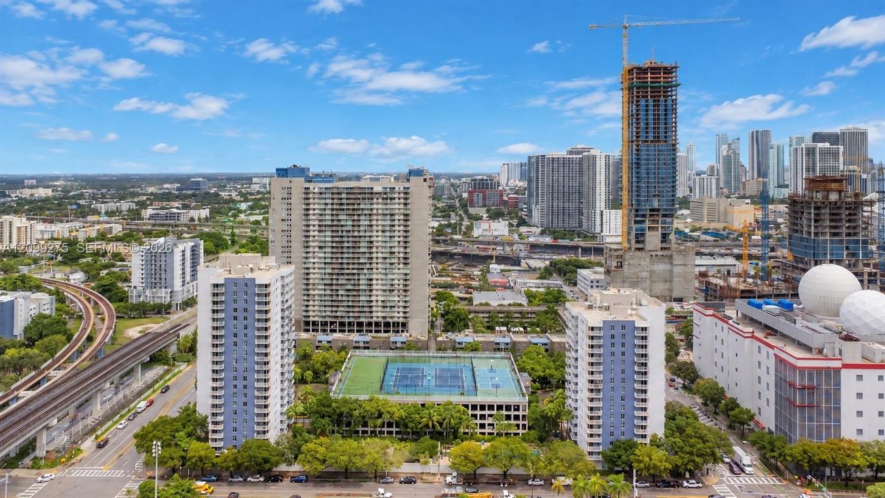 Panoramic skyline views showcasing Miami’s vibrant urban landscape, with high-rise residences, ongoing new developments, and convenient access to public transportation.