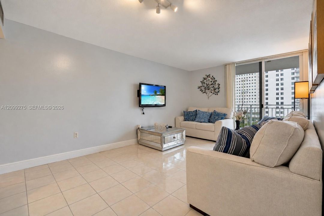 Private balcony offering open views of downtown Miami, landscaped grounds, and sports courts—an ideal spot to enjoy the fresh air.