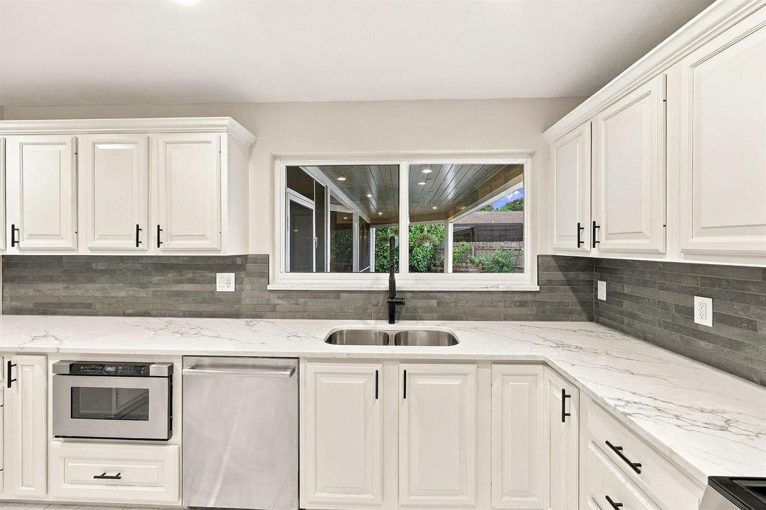 Kitchen Window Overlooks Backyard