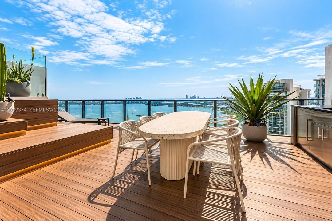 Rooftop dining area with panoramic bay views