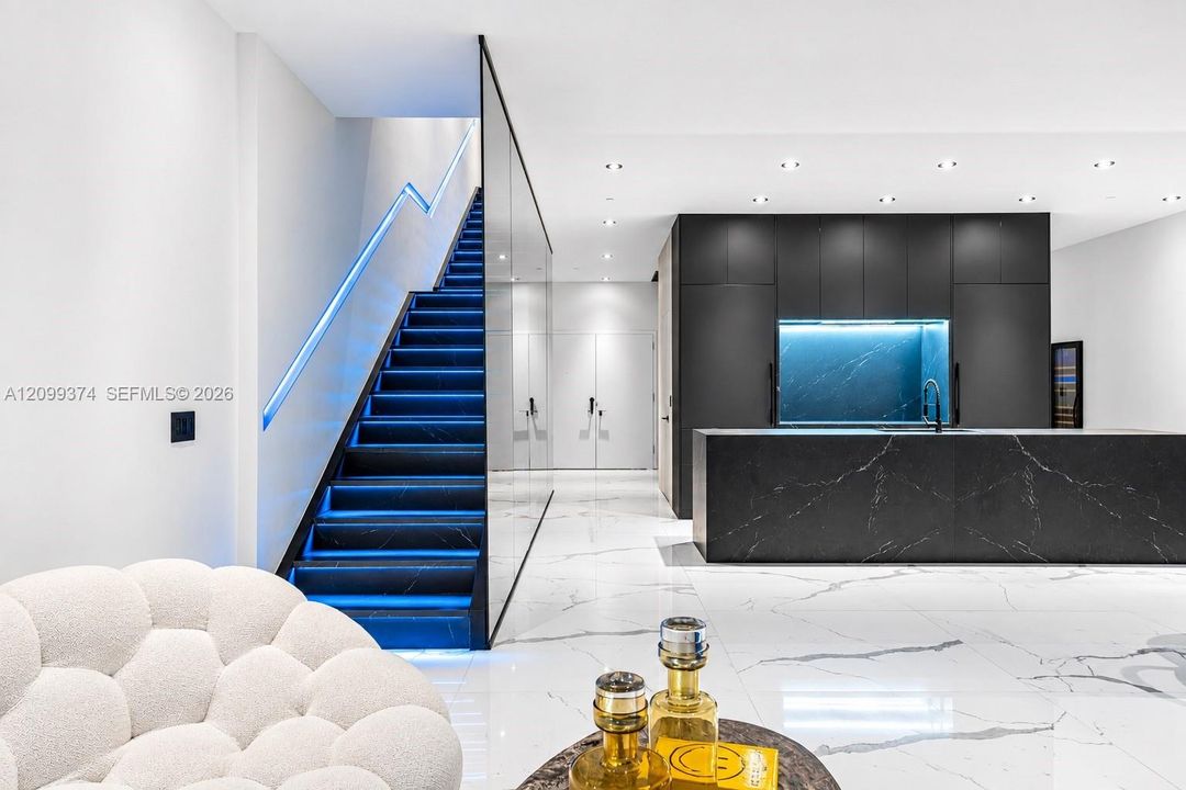 Sculptural staircase with custom integrated lighting