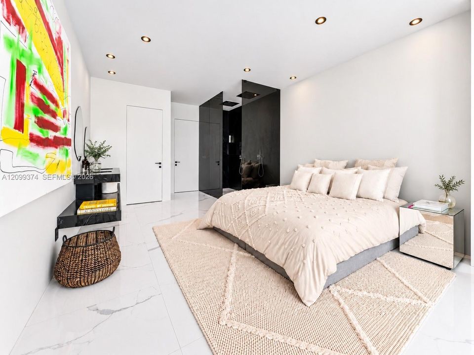 Spacious bedroom with ensuite bath and custom storage