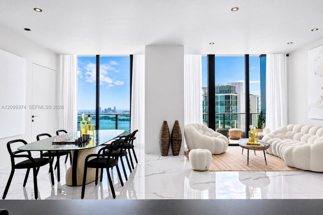 Open dining and living area with abundant natural light