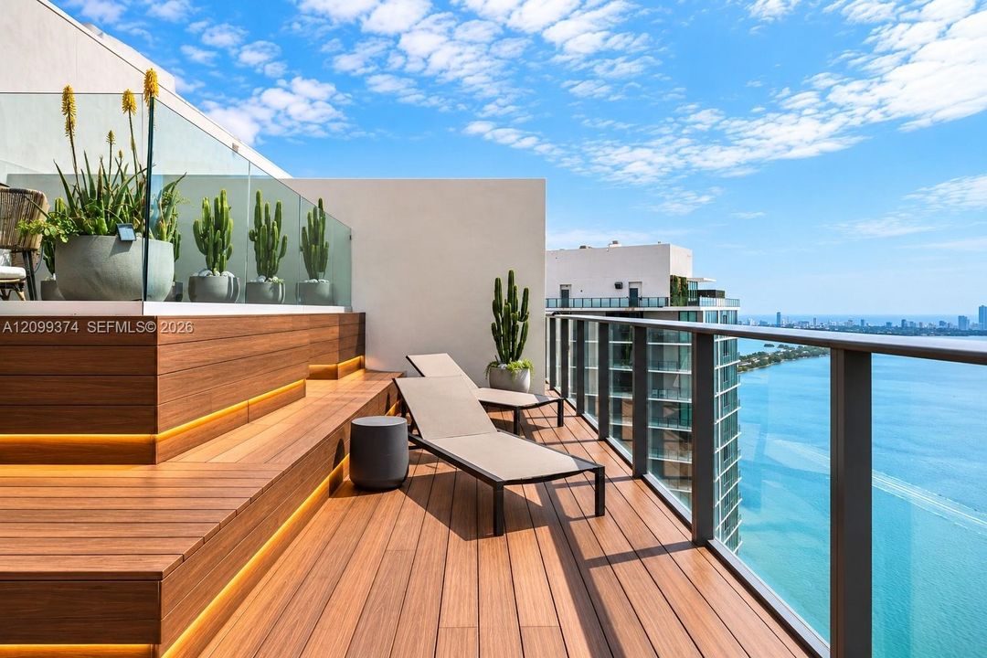 Rooftop tanning and relaxation area overlooking the bay