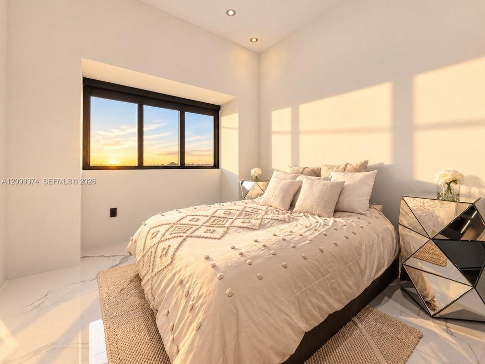 Bright bedroom with natural light and wide windows