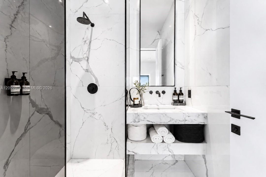Modern bathroom with glass shower and custom vanity