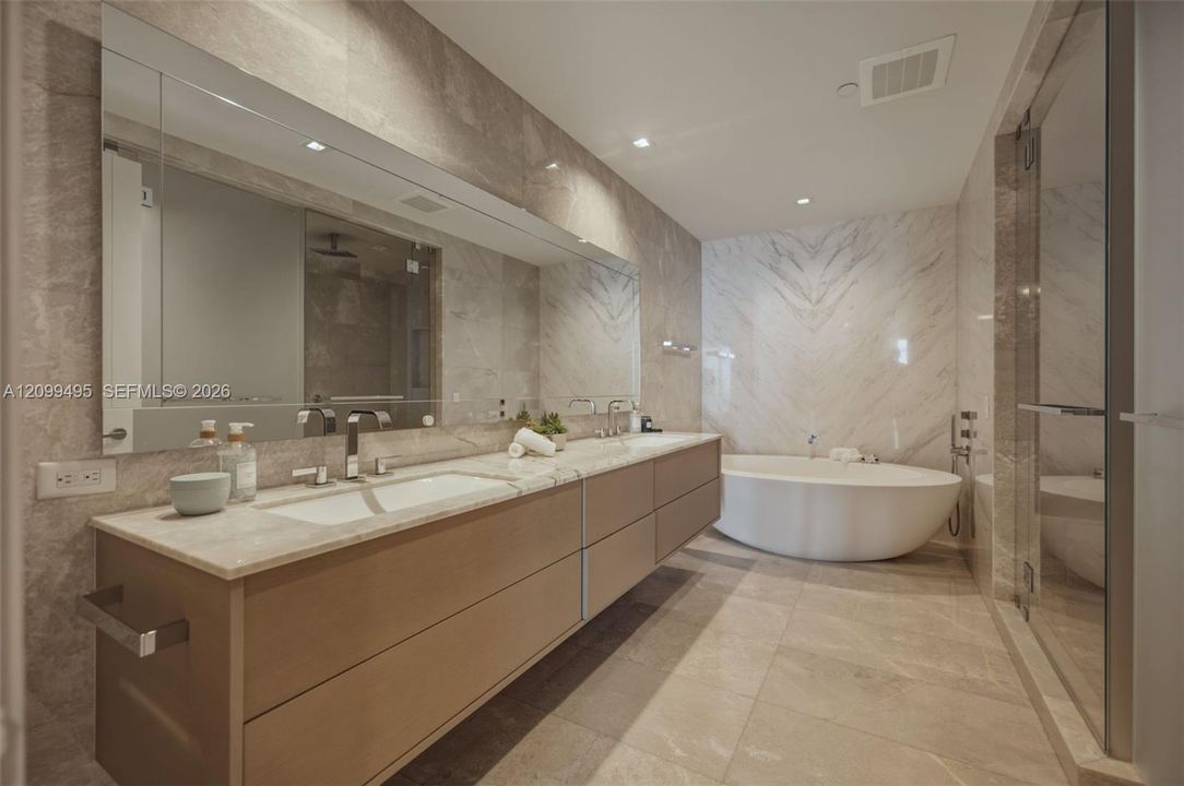 Large custom made walk-in closet.