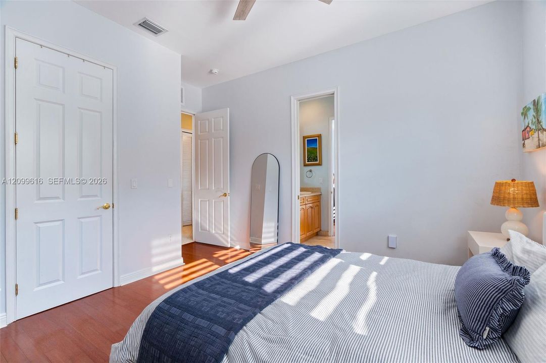 Wood-finish flooring, two-panel interior doors, and neutral wall tones