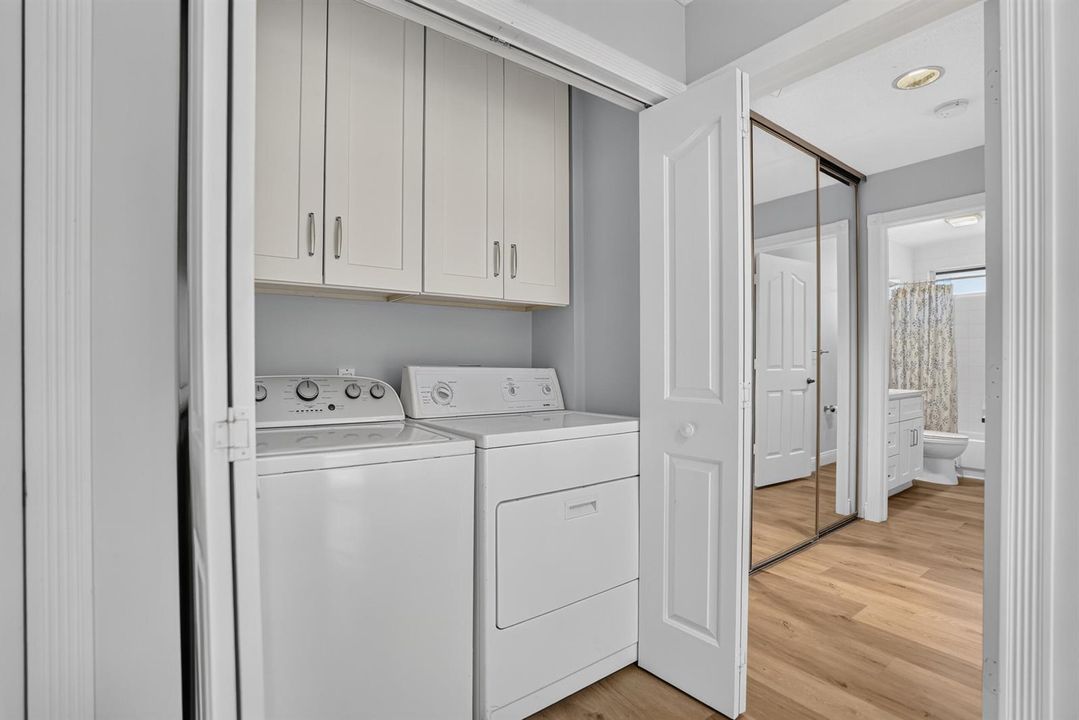 Laundry closet with built in cabinets