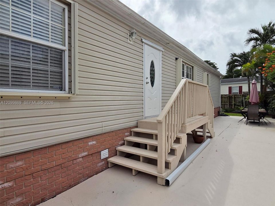Backyard has dual staircase & recently installed NEW back door