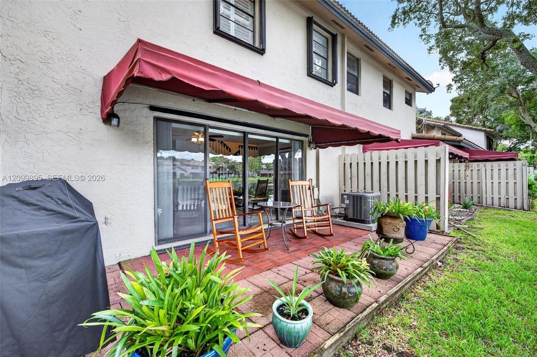 Private patio overlooking peaceful lake views and providing an inviting outdoor retreat.