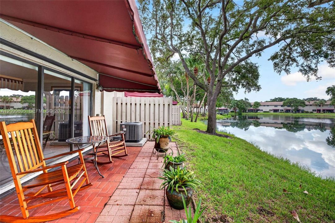 Private patio overlooking peaceful lake views and providing an inviting outdoor retreat.