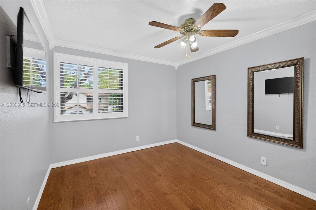 Bright and inviting bedroom with ample space for furnishings.