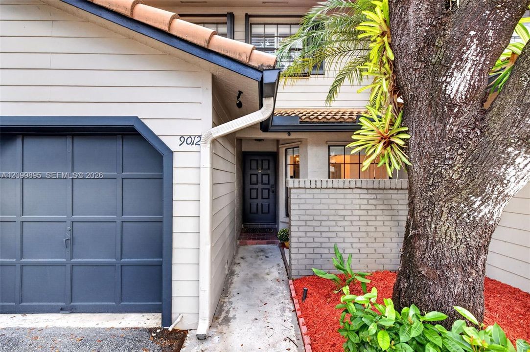 Attached one-car garage provides convenient parking and additional storage space.