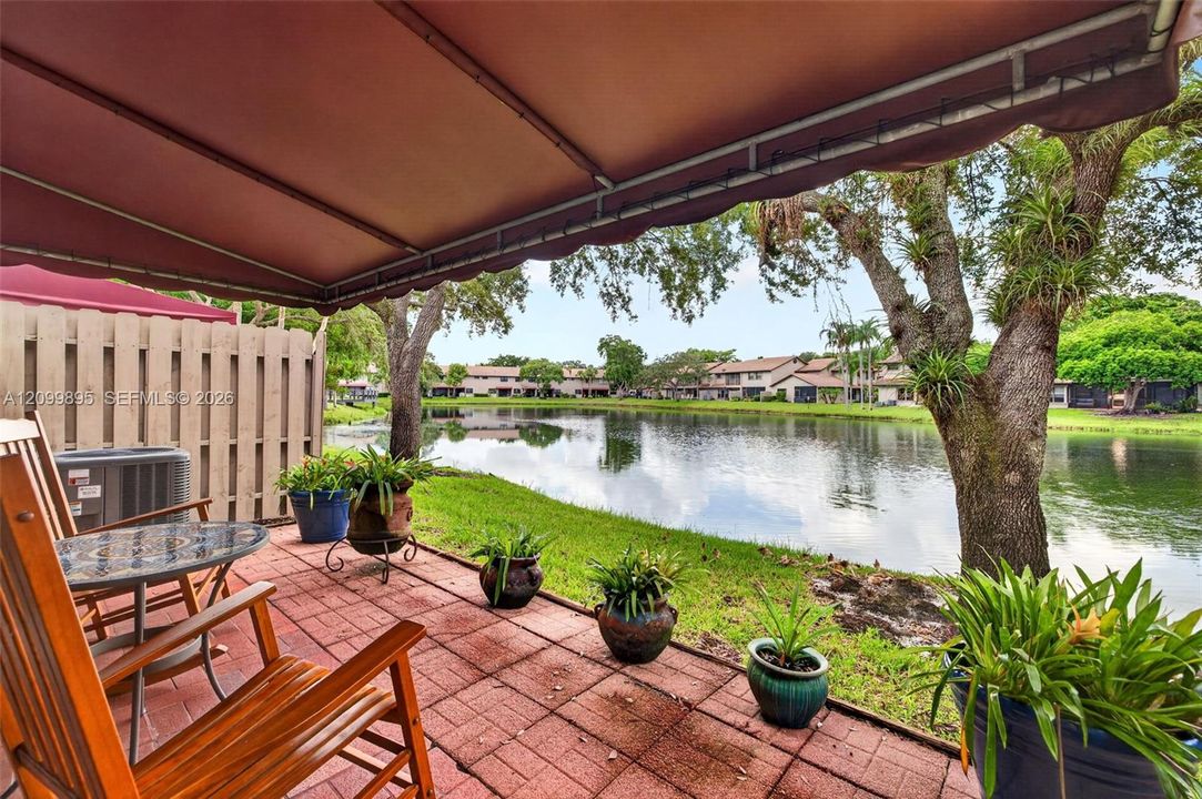 Private patio overlooking peaceful lake views and providing an inviting outdoor retreat.