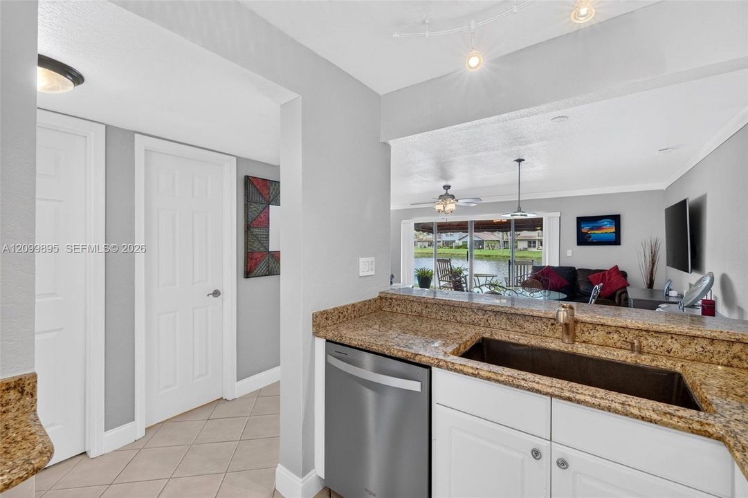 Well-equipped kitchen featuring ample cabinetry, a pantry and a convenient breakfast area.